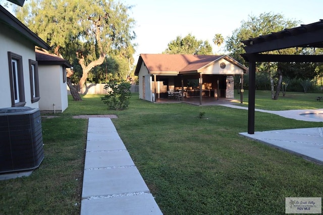 view of yard featuring a patio, cooling unit, and a pergola