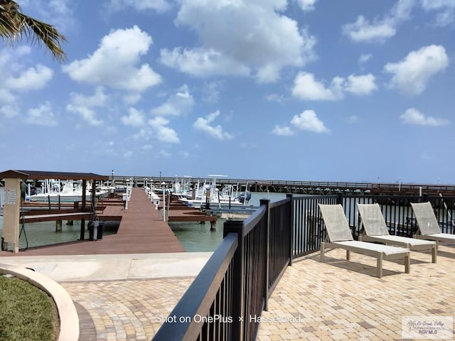 view of dock with a water view and boat lift