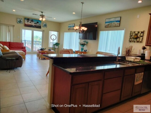 301 E Houston St Unit 1201, Port Isabel, TX 75052 - kitchen featuring pendant lighting, dark countertops, open floor plan, recessed lighting, and a sink