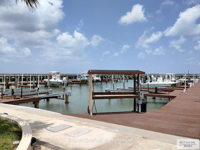 view of dock featuring boat lift and a water view