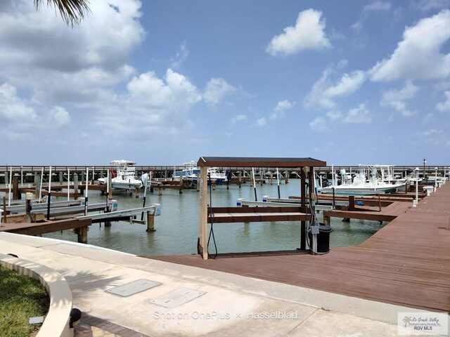 301 E Houston St Unit 1201, Port Isabel, TX 75052 - view of dock featuring boat lift and a water view