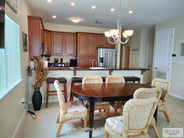 dining room featuring visible vents, baseboards, recessed lighting, a chandelier, and light tile patterned floors