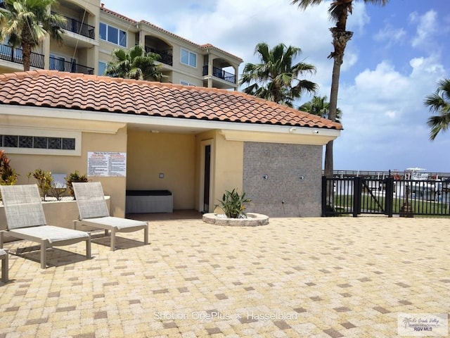 view of patio featuring fence