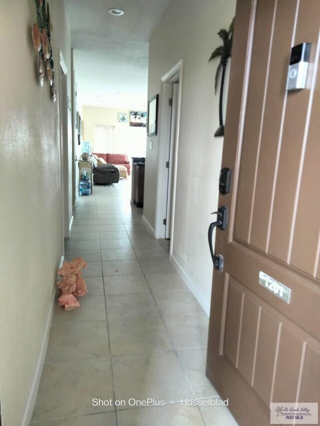 301 E Houston St Unit 1201, Port Isabel, TX 75052 - hall with light tile patterned floors and baseboards