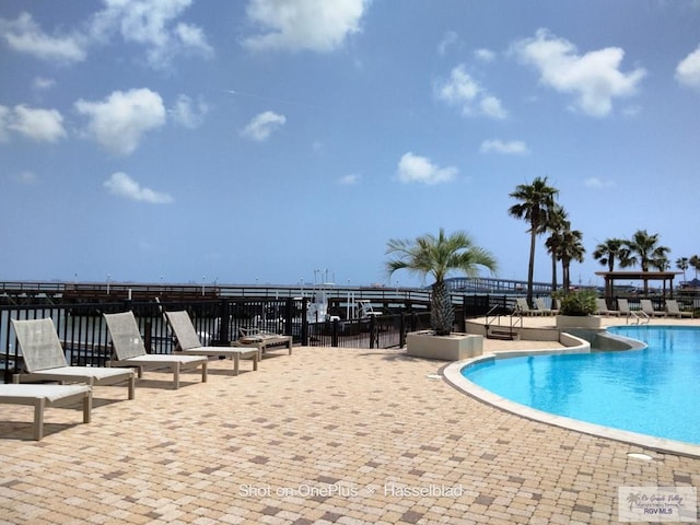 pool with a patio area