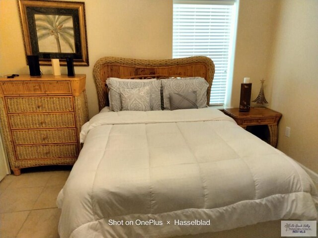 301 E Houston St Unit 1201, Port Isabel, TX 75052 - tiled bedroom with multiple windows