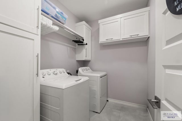 31689 E Jardin E, Los Fresnos, TX 78566 - laundry area featuring washing machine and dryer and cabinet space