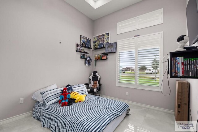 31689 E Jardin E, Los Fresnos, TX 78566 - tiled bedroom featuring baseboards