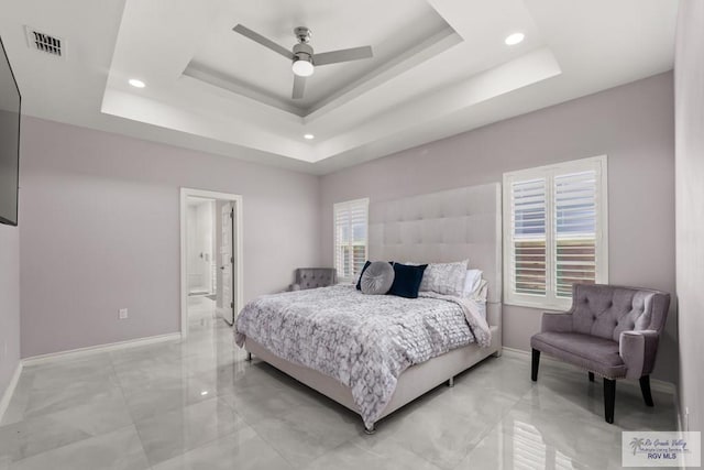 31689 E Jardin E, Los Fresnos, TX 78566 - bedroom with a raised ceiling, recessed lighting, light marble finish floors, ensuite bathroom, and a ceiling fan