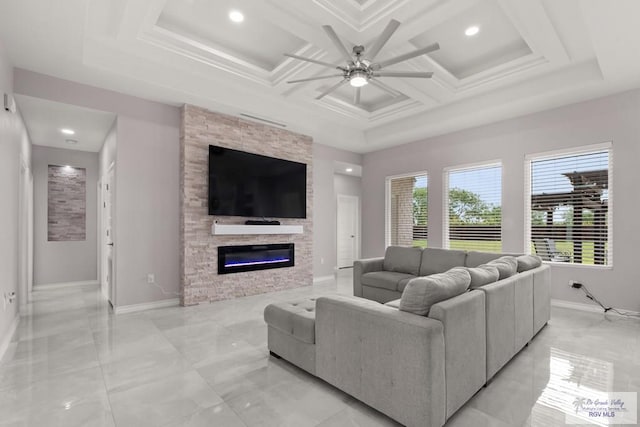 31689 E Jardin E, Los Fresnos, TX 78566 - living area featuring ceiling fan, a stone fireplace, coffered ceiling, recessed lighting, and light marble finish floors