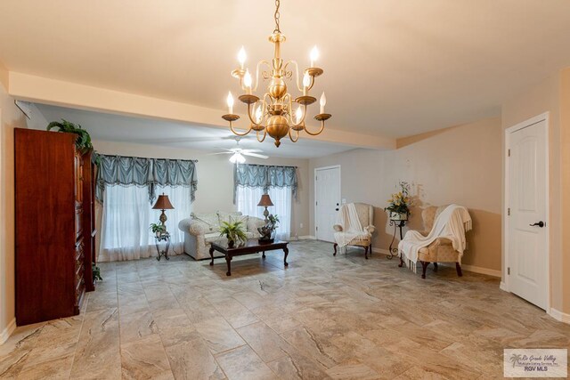 living area featuring ceiling fan with notable chandelier