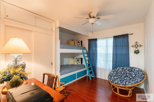 bedroom with ceiling fan and hardwood / wood-style floors