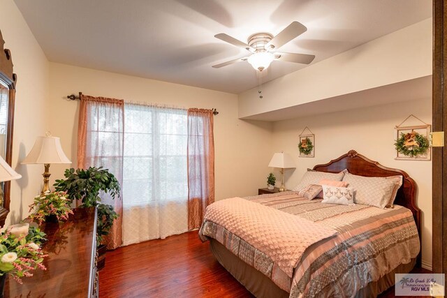 bedroom featuring ceiling fan and dark hardwood / wood-style flooring