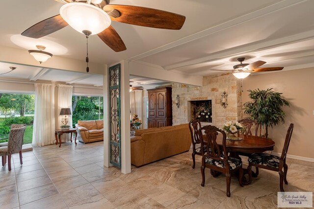 dining area with beam ceiling