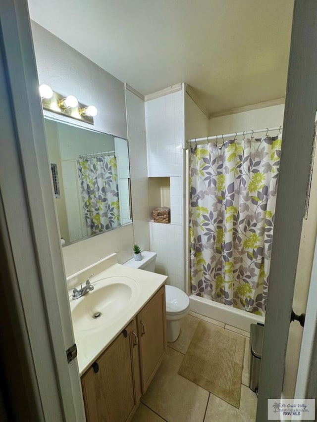 1901 Martha St, Harlingen, TX 78550 - bathroom featuring tile patterned flooring, vanity, and a shower with shower curtain