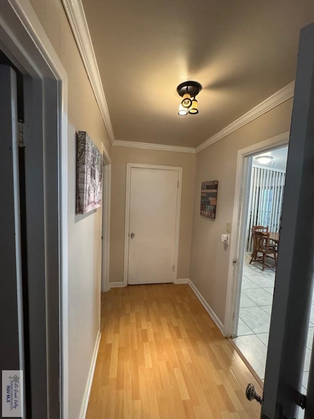 1901 Martha St, Harlingen, TX 78550 - hall featuring light wood finished floors and ornamental molding