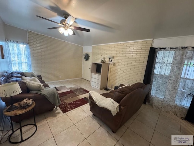 1901 Martha St, Harlingen, TX 78550 - living area with brick wall, ceiling fan, and light tile patterned floors