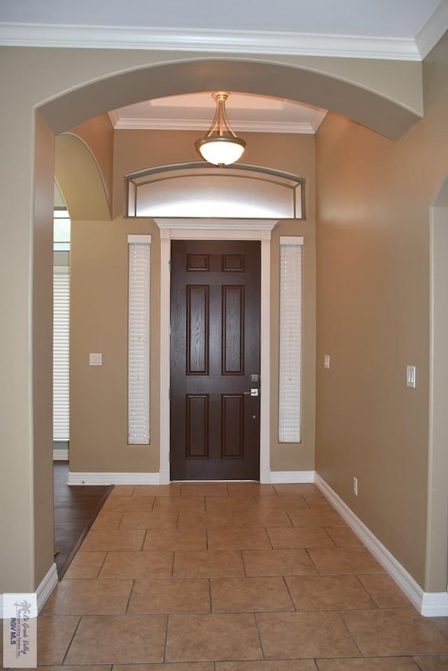 1714 Christian Cir, Harlingen, TX 78550 - entryway with arched walkways, baseboards, and ornamental molding