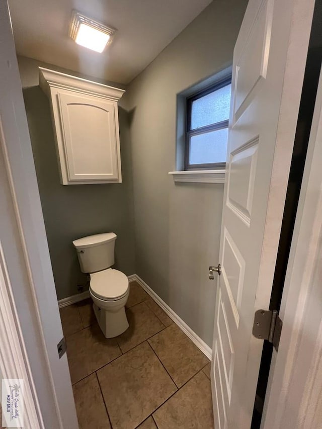 1714 Christian Cir, Harlingen, TX 78550 - bathroom featuring toilet, tile patterned flooring, and baseboards