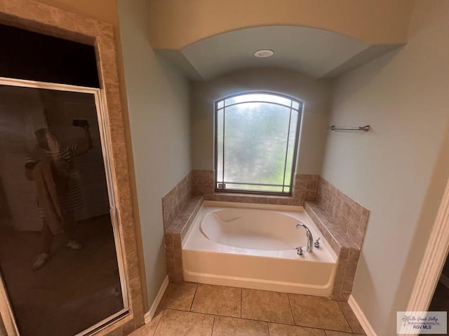 1714 Christian Cir, Harlingen, TX 78550 - bathroom with a bath, a shower stall, tile patterned floors, and baseboards