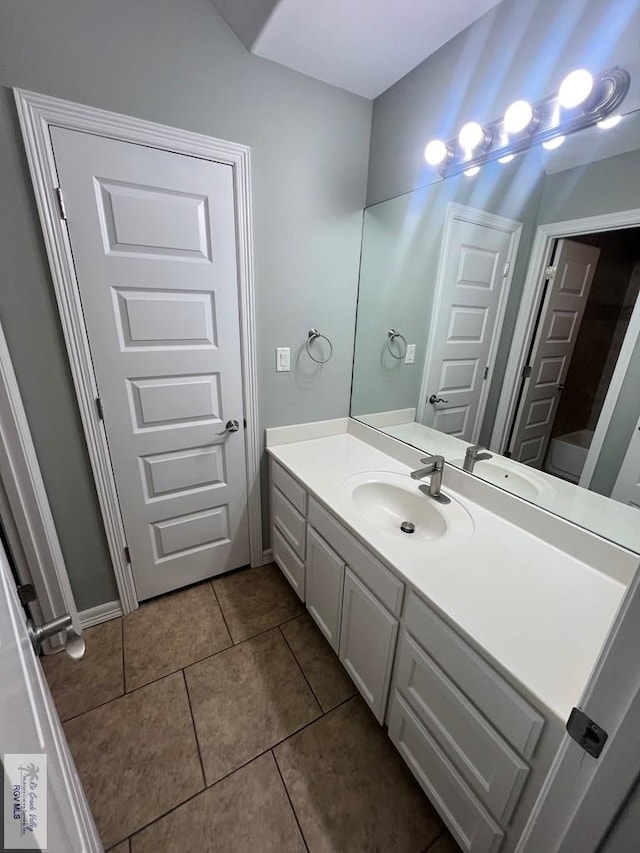 1714 Christian Cir, Harlingen, TX 78550 - bathroom featuring vanity, tile patterned floors, and baseboards