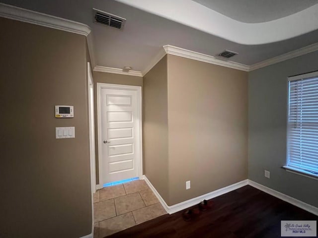 1714 Christian Cir, Harlingen, TX 78550 - entryway with baseboards, crown molding, and wood finished floors