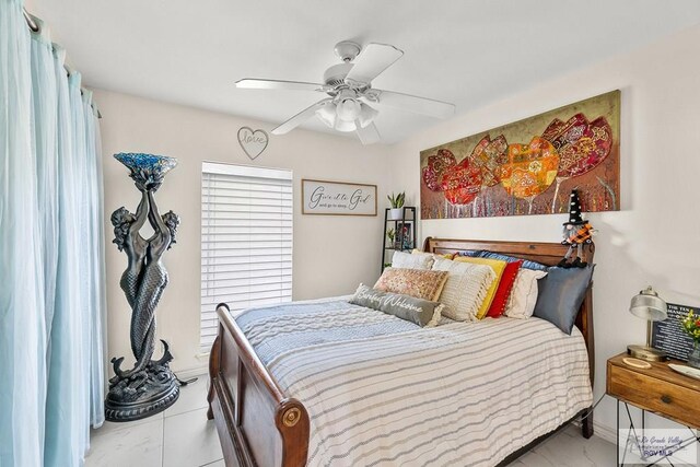 bedroom featuring ceiling fan and light tile patterned flooring