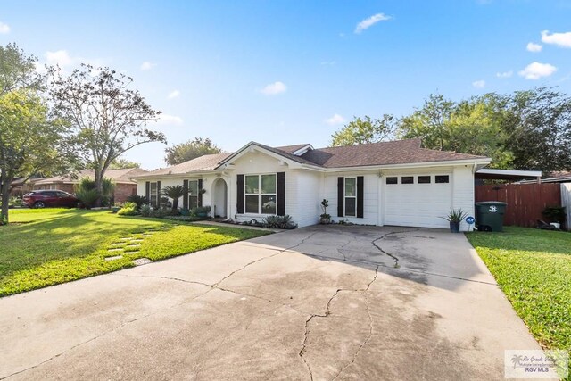 single story home with a garage and a front yard