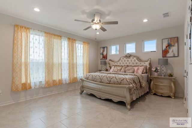 bedroom with ceiling fan and light tile patterned floors