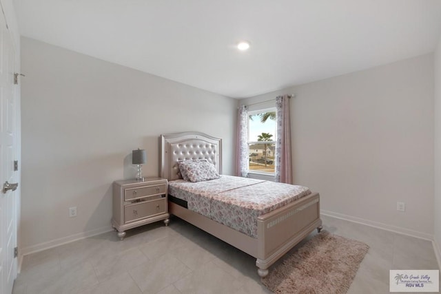 bedroom featuring light tile patterned flooring