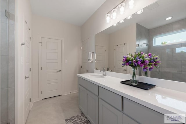 bathroom featuring vanity and a shower with shower door