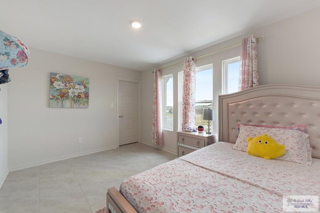 bedroom featuring light tile patterned flooring