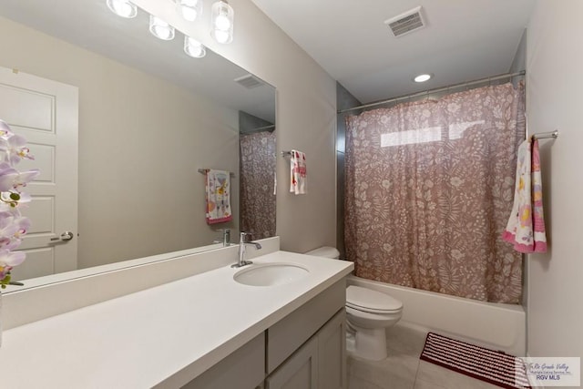 full bathroom featuring tile patterned flooring, vanity, toilet, and shower / bathtub combination with curtain