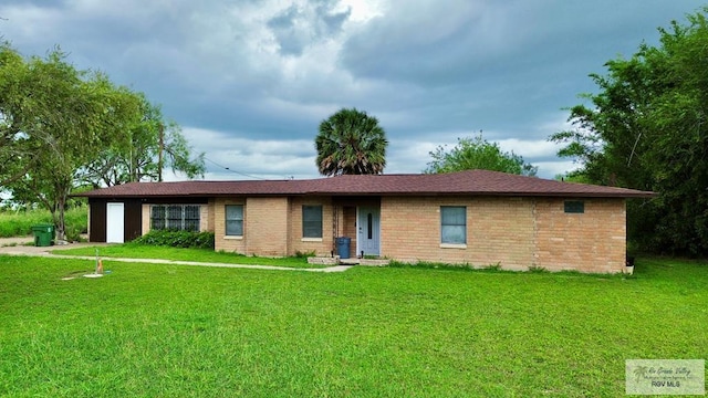 12776 State Highway 186, Raymondville, TX 78580 - ranch-style house with a front lawn