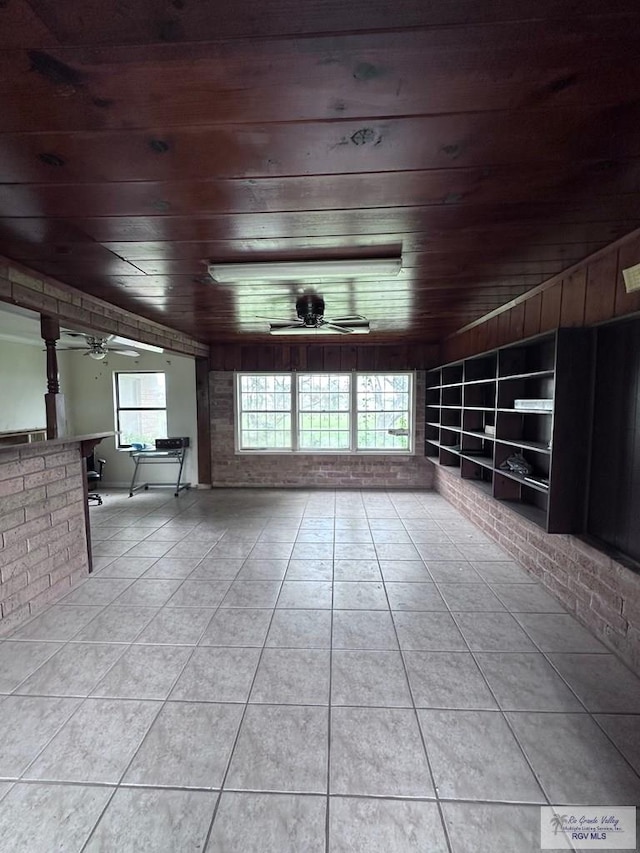 12776 State Highway 186, Raymondville, TX 78580 - unfurnished living room featuring a ceiling fan, wood ceiling, and tile patterned floors
