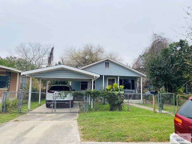 bungalow-style home with a detached carport, a front lawn, a fenced front yard, and a gate