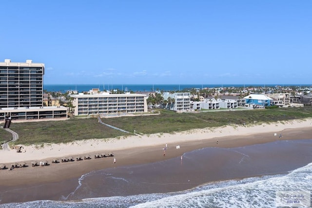 birds eye view of property featuring a water view and a view of the beach