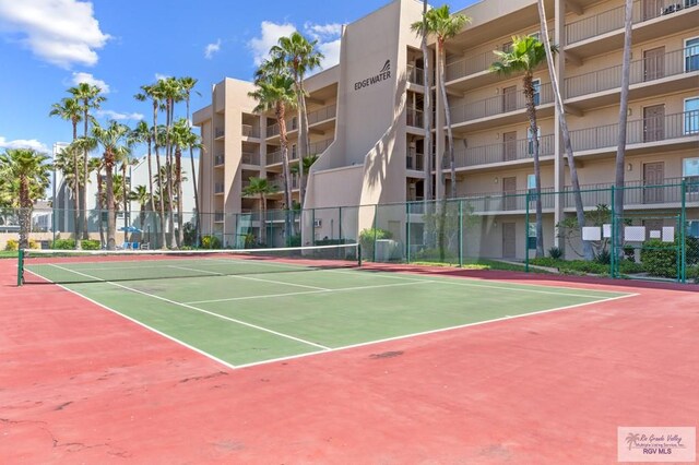 view of sport court featuring basketball hoop