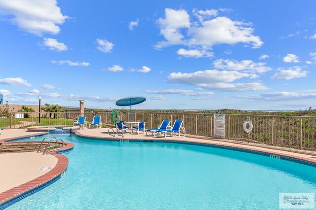 view of pool featuring a patio