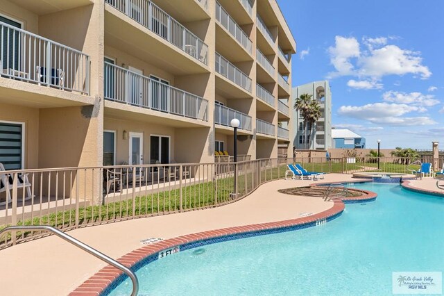 view of swimming pool featuring a patio