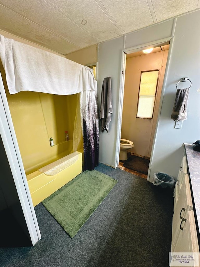 full bathroom with vanity, shower / bathtub combination with curtain, and toilet