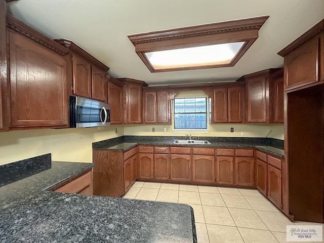 kitchen with sink and light tile patterned floors