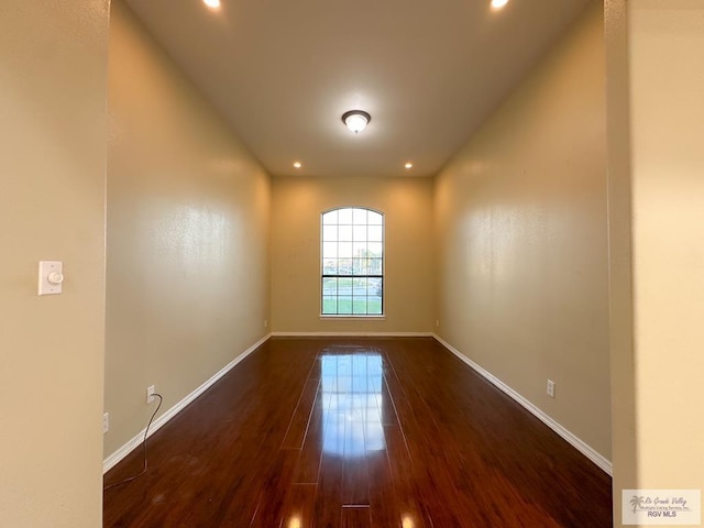 spare room featuring dark hardwood / wood-style floors