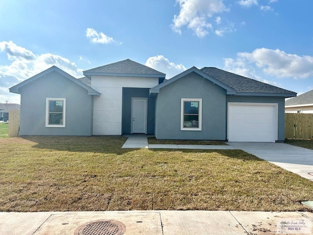 ranch-style home with a garage and a front yard