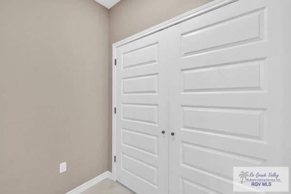 interior space featuring baseboards