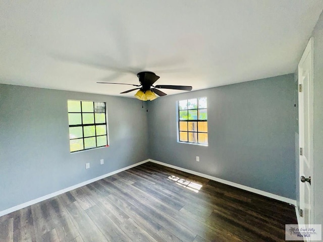 spare room featuring ceiling fan and dark hardwood / wood-style floors