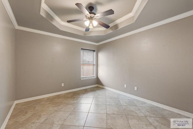 tiled spare room with crown molding, ceiling fan, and a raised ceiling