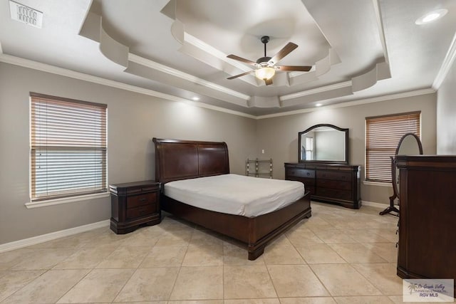 tiled bedroom featuring ornamental molding, a raised ceiling, and ceiling fan