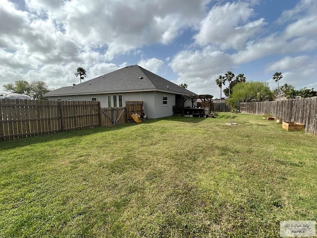 view of yard with a fenced backyard