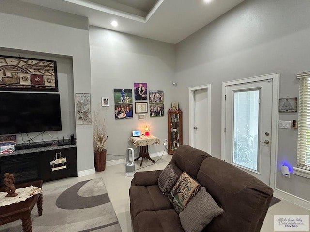 living area with recessed lighting and baseboards